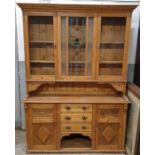 A 20th century pine dresser, with a glazed top sec