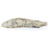 A fossilised fish, approx 51cm long