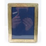 A silver rectangular photograph frame with rounded