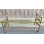 An early 20th century brass dolls bed, 37cm high,