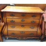 A 18th century bombe shaped chest of drawers, with