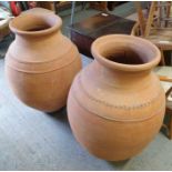 A near pair of terracotta olive jars/pots, approxi
