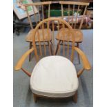 An Ercol elm and beech open armchair, along with a