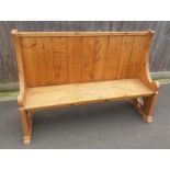 A 20th century slat back pine bench, with curved