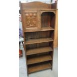 An Arts and Crafts style oak bookcase, with a sing