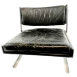 A mid century black leather upholstered chair, sta