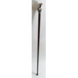 A 20th century mahogany walking cane with a sterli