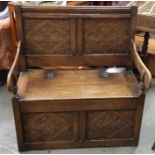 A 20th century bench, with a carved back panel and