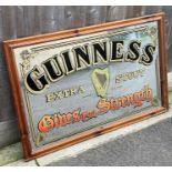 Two vintage advertising mirrors, Guinness and Sout