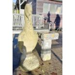 Reconstituted stone statue of a pelican along with