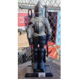 Cast iron fireside set in the form of a knight