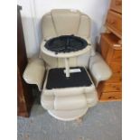 Leather upholstered easy chair with matching foots