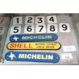 Enamel numbers from 1 to 9 along with 2 Michelin s