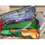 2 cased violins