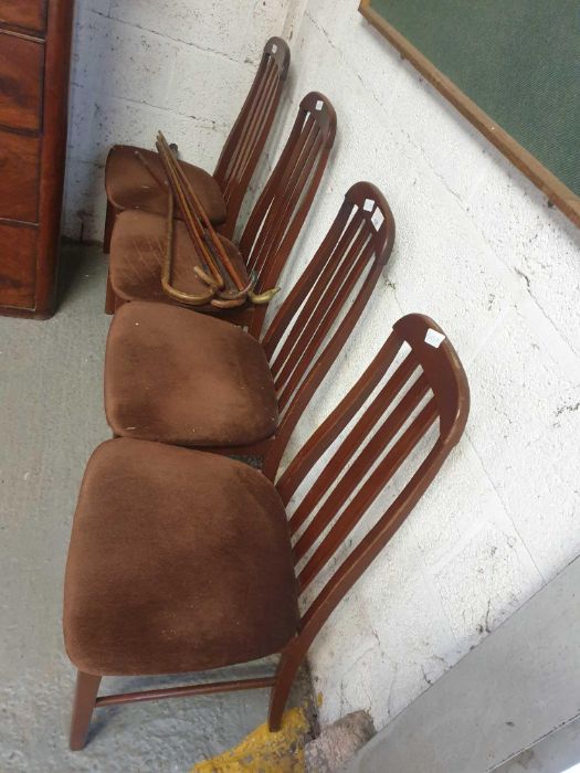 4 mid century style dining chairs along with a col