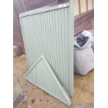 Green painted garden arbour with sides, back and ro