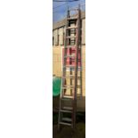 Wooden double extending ladder along with a metal