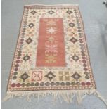 A collection of four rugs including a Turkish runn