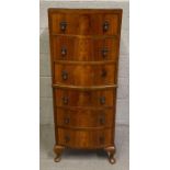 A 20th century walnut tallboy, set with six drawer