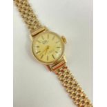 A ladies gold automatic Lynk wrist watch, the round cha
