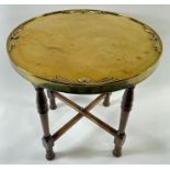 An Art Deco brass topped folding table, 55cm high,