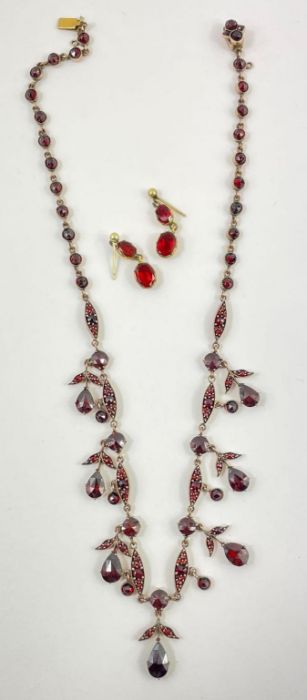 A pair of red paste double drop earrings; together