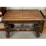 A Victorian carved dark oak side table, with singl