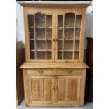 A 20th century pine dresser, with two glazed doors