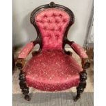 A 20th century open armchair, with a button back