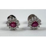 A pair of ruby and diamond cluster ear studs, in u