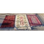 A collection of four vintage rugs, including a Tur