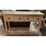 A Victorian pine dresser base with a two single dr