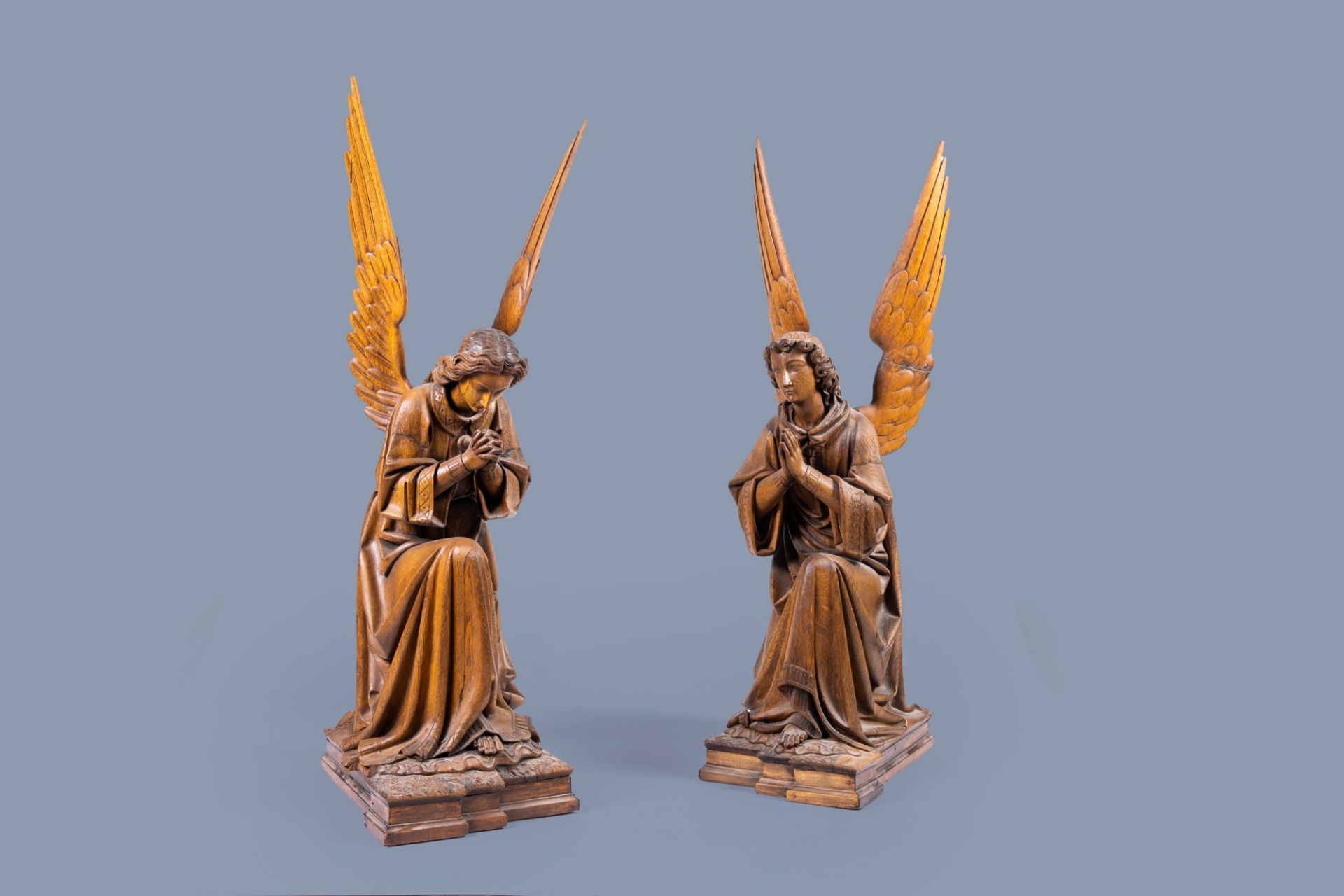 A pair of large carved oak wooden Gothic Revival angels, Belgium or France, 19th C.