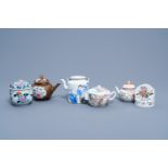 Four various Chinese famille rose teapots and covers, a bowl and cover with floral design and a 'qil