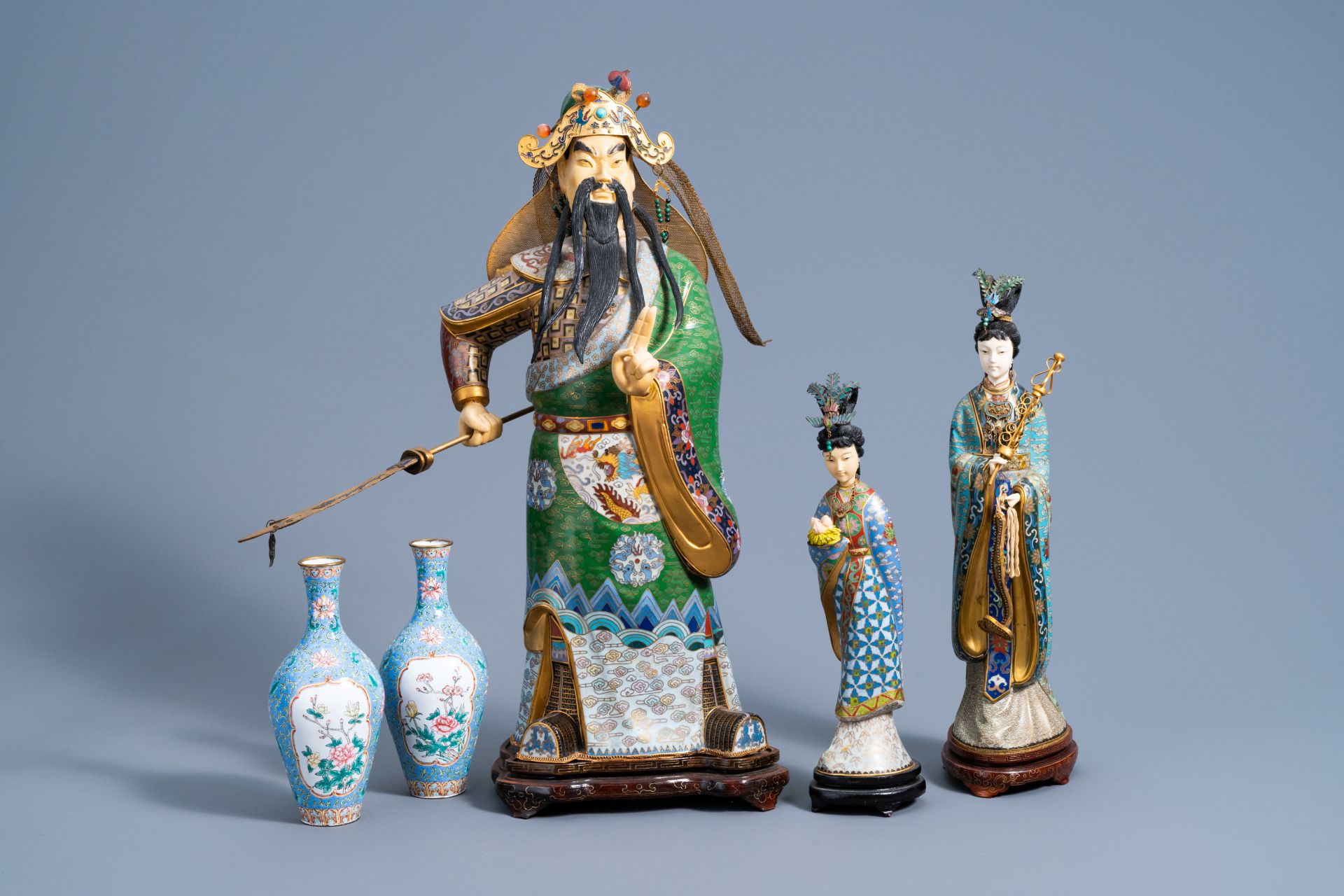 Three Chinese cloisonnŽ figures and a pair of enamel vases with floral design, 20th C.