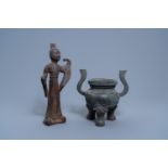 A Chinese bronze censer and a cast iron figure of a lady, Ming and Qing