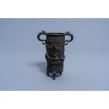 A Chinese bronze incense stick holder or brush pot with an animated relief scene, Qing