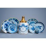 A Brussels blue and white tobacco jar, six Dutch Delft plates with floral design and a holy water fo