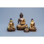 Four Sino-Tibetan partly gilt bronze figures of Buddha, 20th C.