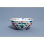 A Chinese wucai bowl with figures in a garden, Wanli mark, 19th/20th C.