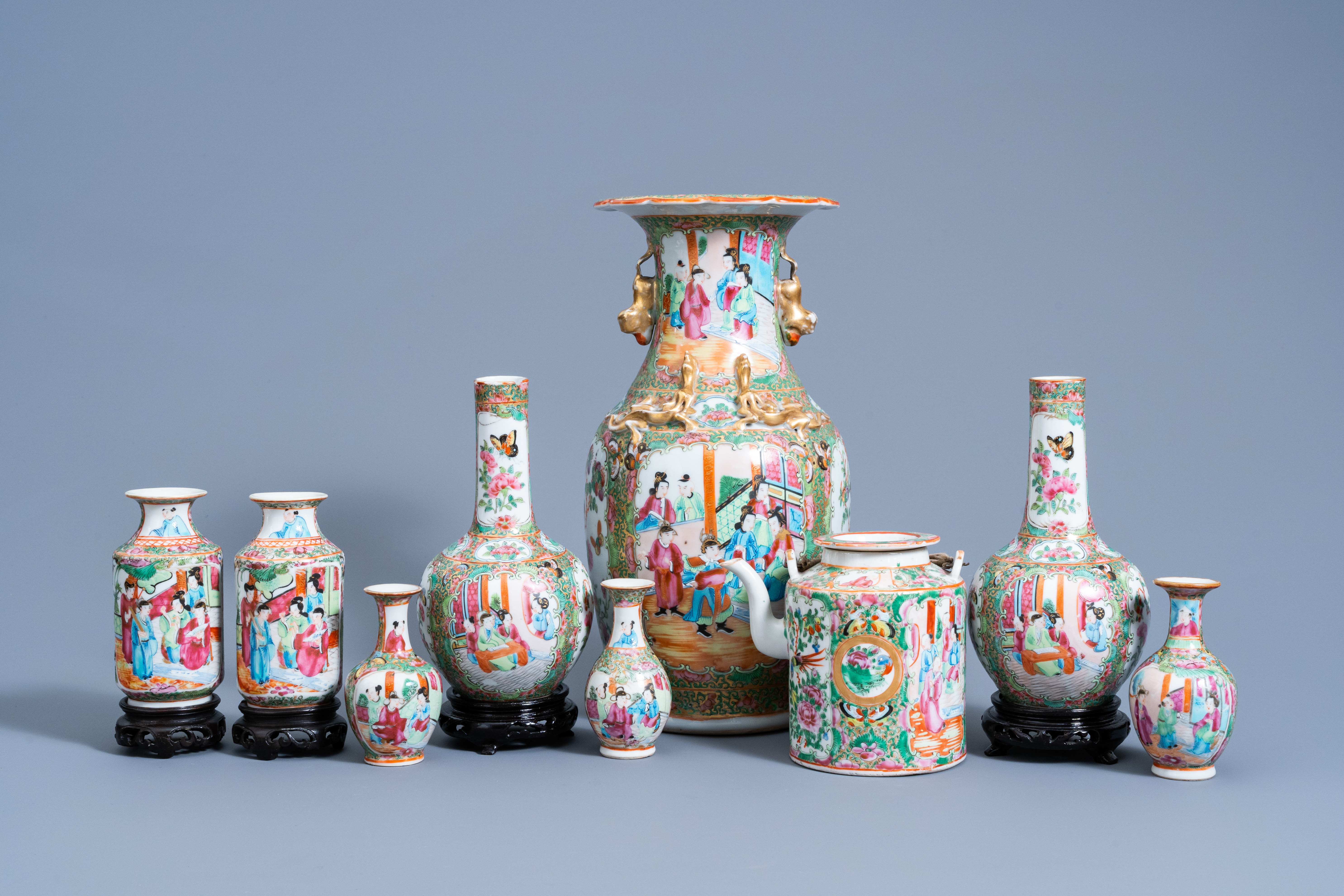 Eight Chinese Canton famille rose vases and a teapot and cover, 19th C.