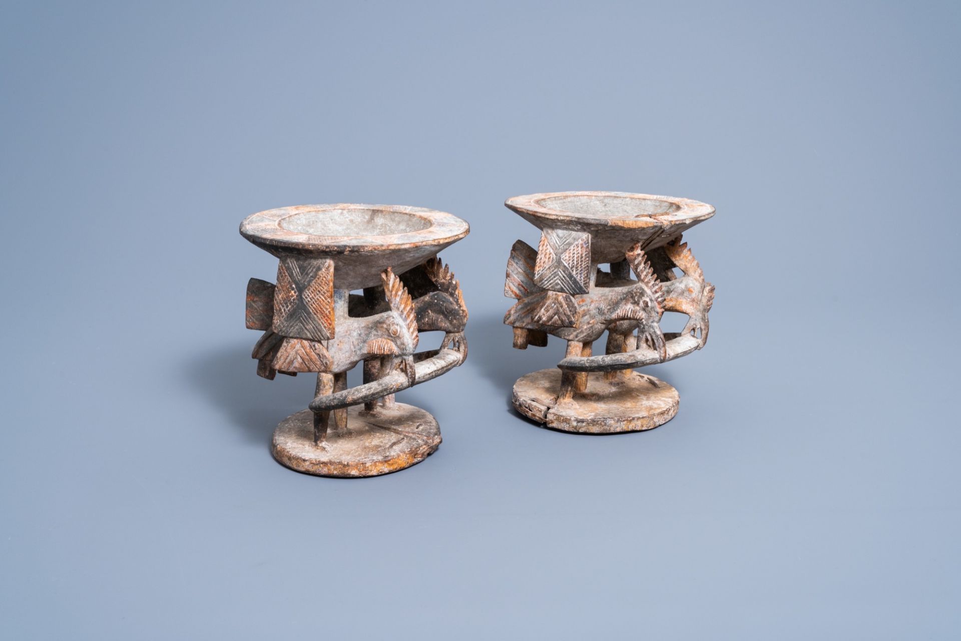 A pair of carved wood and polychrome painted 'Ifa divination' bowls with birds, Yoruba, Nigeria, 20t