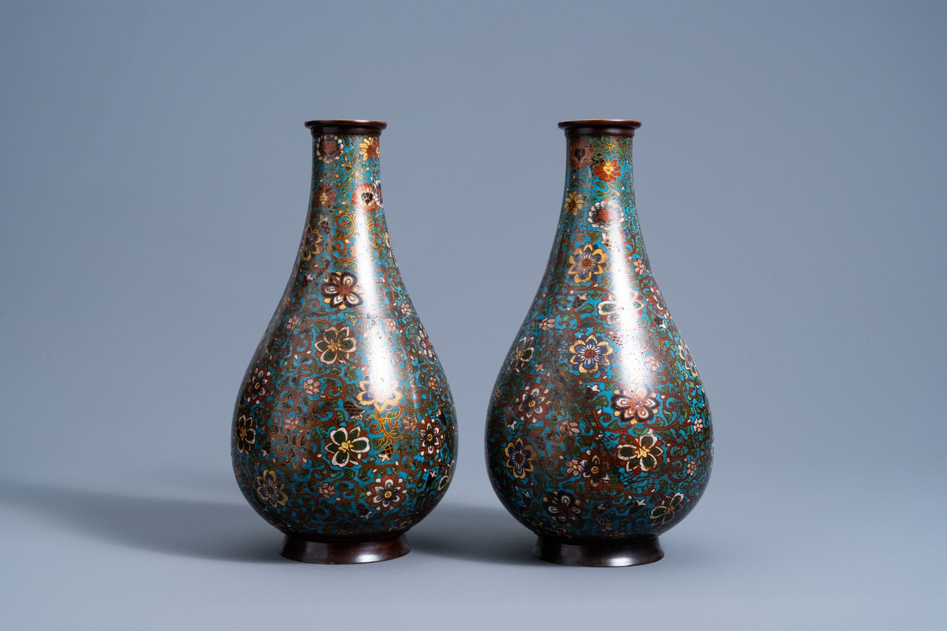 A pair of Chinese bottle shaped cloisonnŽ vases with floral design, 19th/20th C. - Image 3 of 6