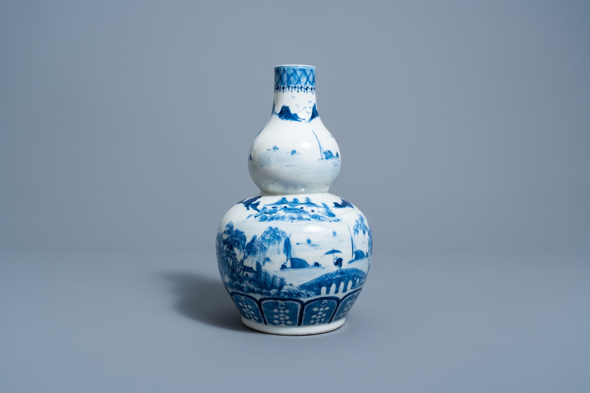 A Chinese blue and white double gourd 'landscape' vase, 19th C. - Image 3 of 6