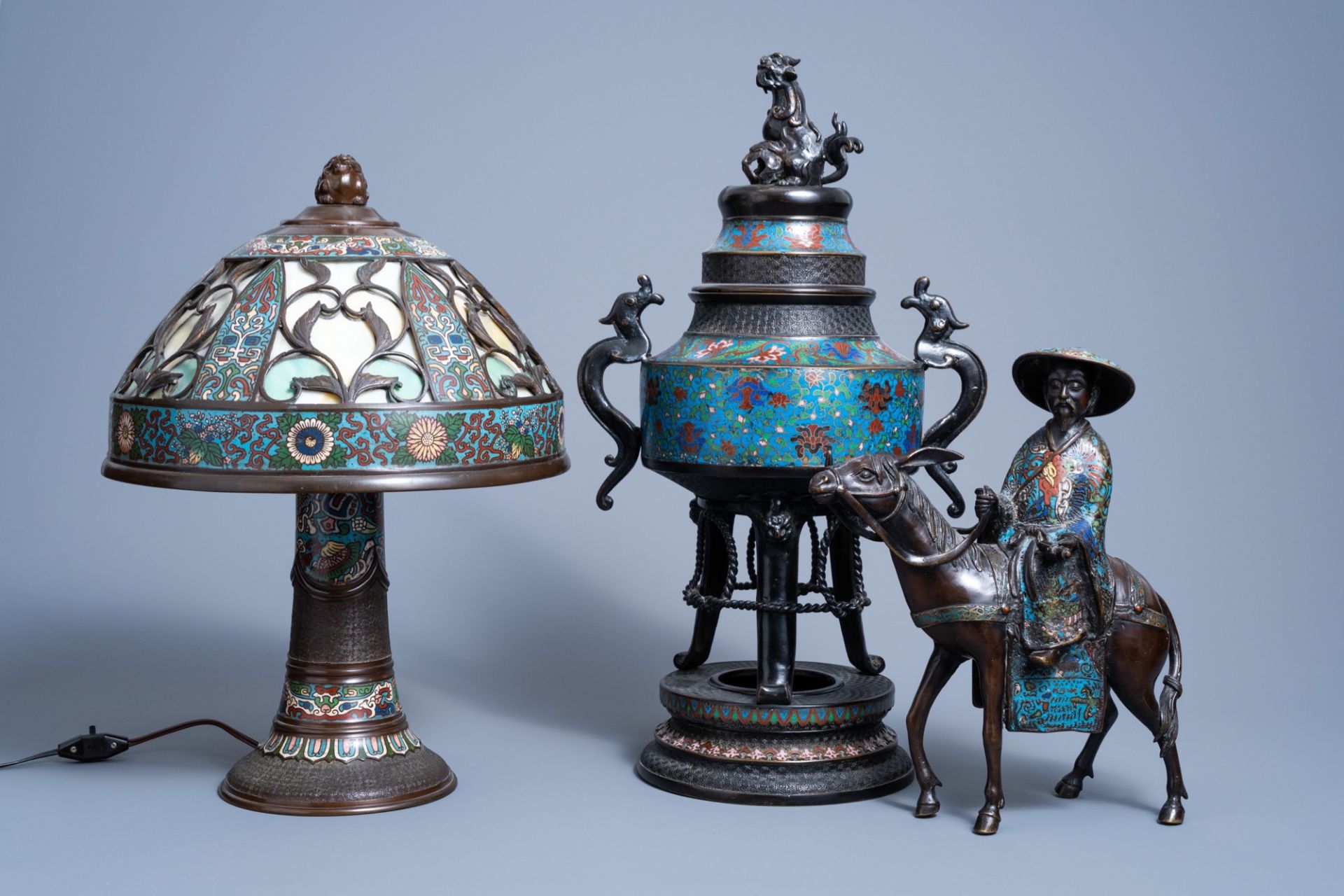 A Japanese champlevŽ enamel and bronze incense burner, a group with Toba on his mule and a table lam
