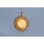 An 18 carat yellow gold pendant set with an 1958 21,6 carat British sovereign, 20th C.