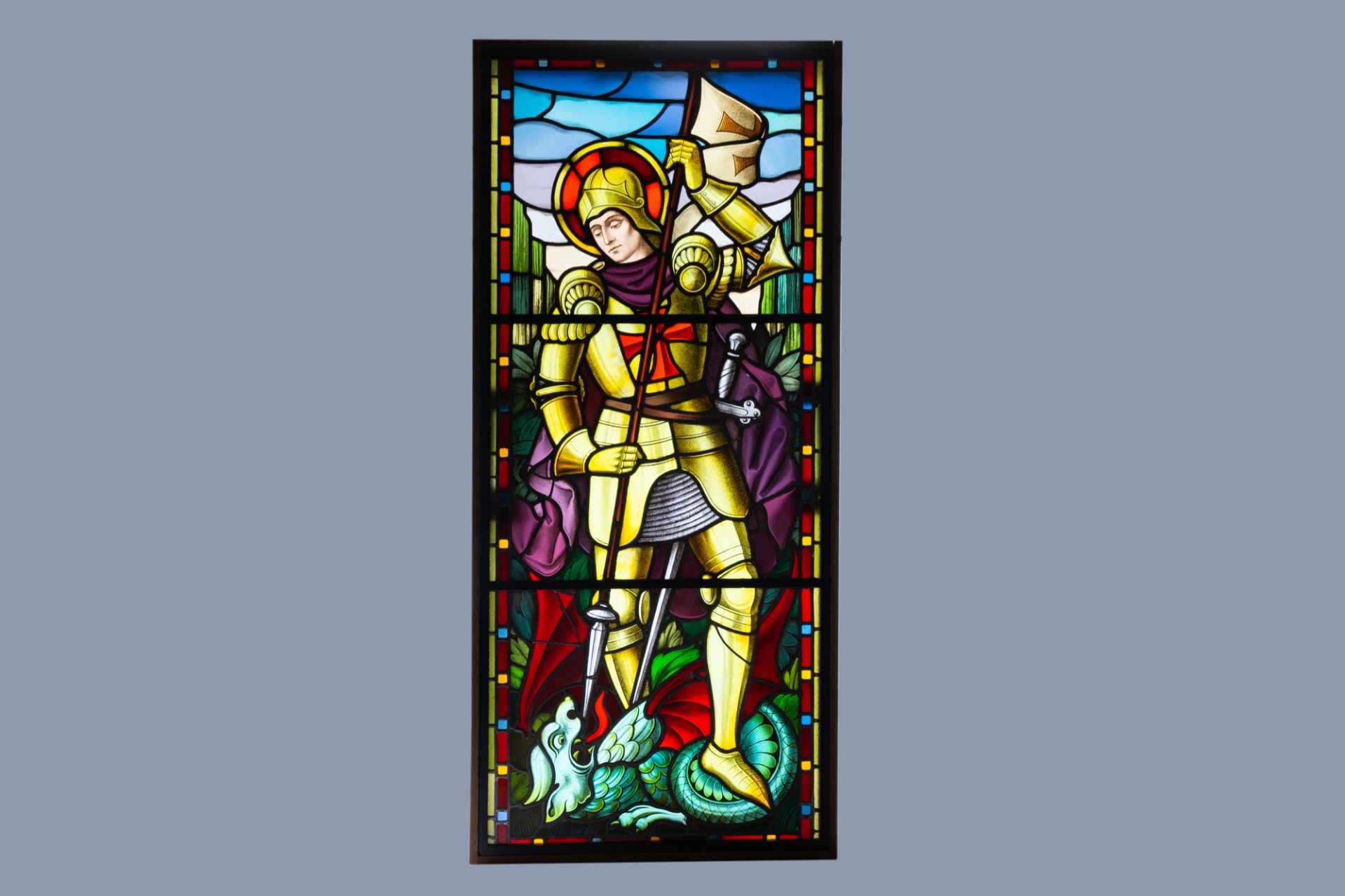 A large painted and stained glass window with Saint Georges and the dragon, 19th/20th C.