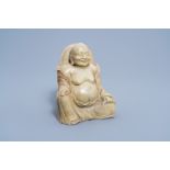 A Chinese carved soapstone figure of a laughing Buddha, 20th C.