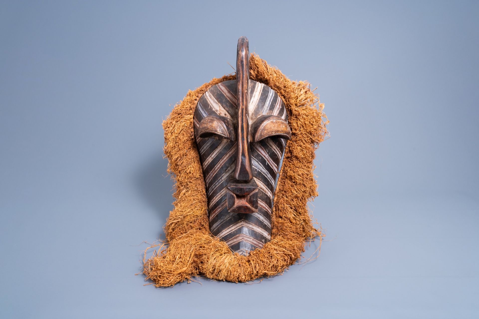 A large carved wood and polychrome painted 'kifwebe' mask, Songye, Congo, late 20th C. - Image 2 of 7