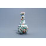 A Chinese famille verte garlic-head mouth vase with a bird among blossoming branches, 19th/20th C.